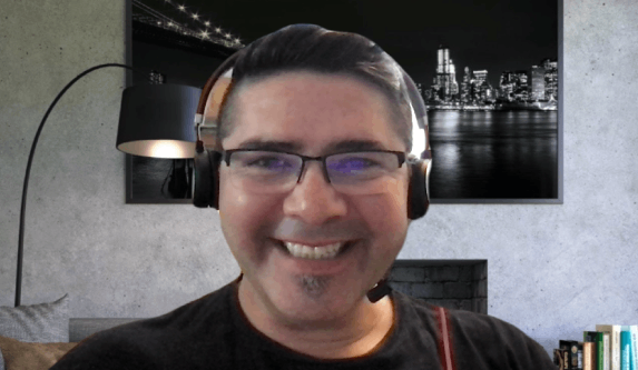 man smiling in webinar