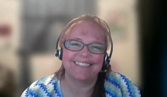 woman smiling in webinar